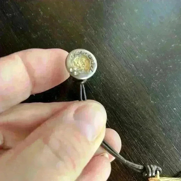 Chloe + Isabel black adjustable cord antique gold plated feather bracelet - Picture 6 of 6